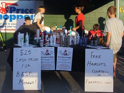 Fans enjoying their free haircuts