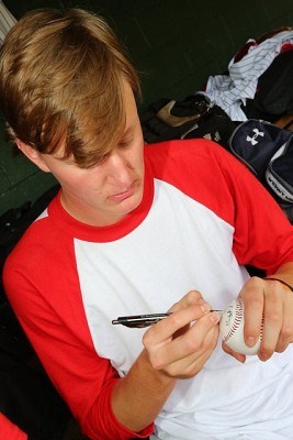 Trey Wingenter (Auburn) signs a ball for a fan