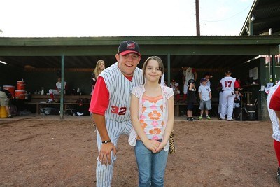 Right Fielder Shane Zimmer (Canisius) with his baseball buddy