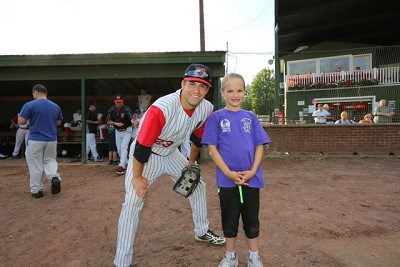 Left Fielder Colin Gay (Maine) with his baseball buddy