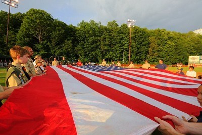 The Boy Scouts hold the flag for the National Anthem