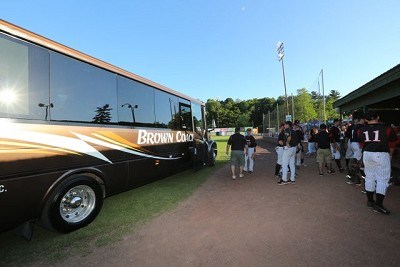 Players are introduced to the field from a Brown's bus, the official carrier of the Mohawks