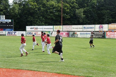 A little league group warming up with the team.