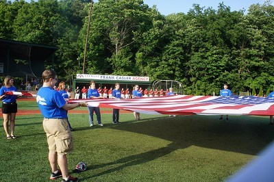 St. Mary's employees holding the flag