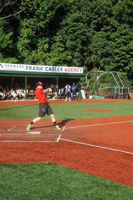 Broadcasting intern Cody takes a few swings at fan batting practice