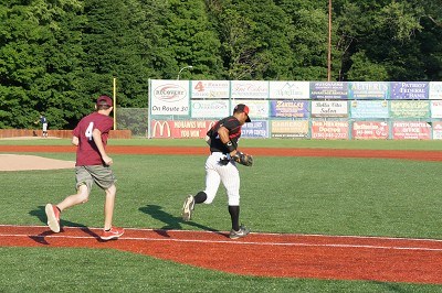 Center Fielder Marcus Carson of Kentucky takes the field with his baseball buddy.