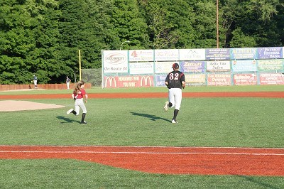 Right Fielder Joe Purritano of Dartmouth runs onto the field with his baseball buddy.