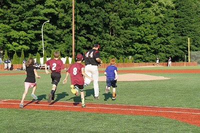 Starting Pitcher EJ Ashworth of Fairfield heads to the mound with his baseball buddies.