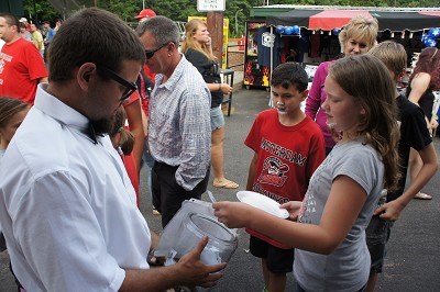 Intern Charlie handing out prizes from the fishbowl.