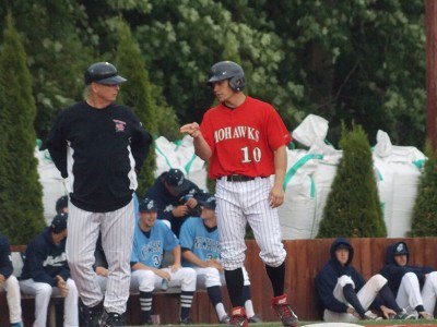 Josh Gardiner of Radford talks to head coach Keith Griffin after advancing to third on a wild pitch in the second inning.