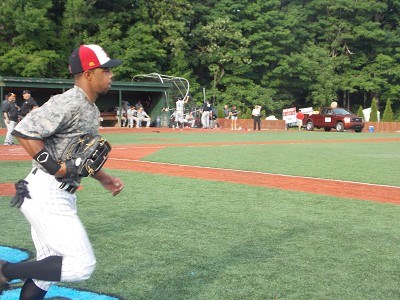 Center Fielder Marcus Carson of Kentucky runs onto the field