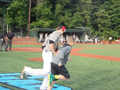 Shortstop Connor Heady of Kentucky takes the field with his baseball buddy.