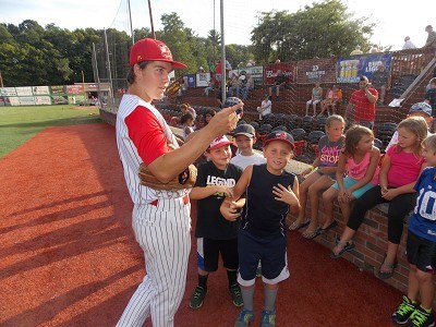 Chris Givin talks with his Baseball Buddies before the game