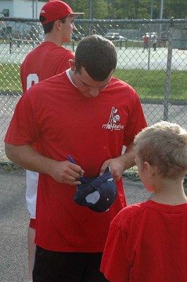 Kentucky's Brock Wright signs an autograph at 