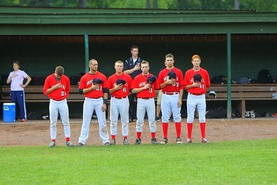 Members of the Mohawks stand for the National Anthem