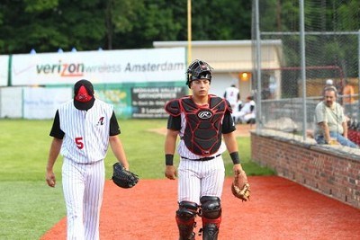 Starting pitcher Zach Logue (Kentucky) returns to the dugout with catcher Scott Manea (NC State)