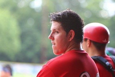 Shane Zimmer (Canisius) stands in the dugout as the rain falls before the game