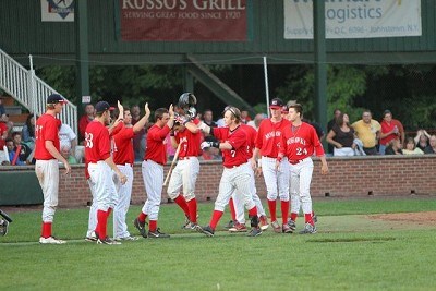 Jordan Ebert (Auburn) high fives his way to the dugout after homering in the third inning