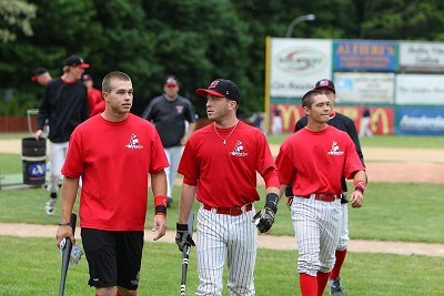 Brian Ruby (Binghamton), Chris Kalica (SCCC) and Josh Gardiner (Radford) return to the dugout after taking BP