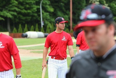 Kevin Guthrie (Brown) returns to the dugout after BP