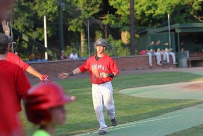 Kyle Barrett (Kentucky) returns to the dugout after scoring in the first inning on a Dylan Smith sacrifice fly to center field