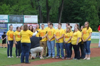 The National Anthem being sung before the game