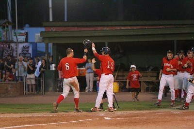 Brian Ruby (Binghamton) high fives John Sansone (Florida State) after scoring in the fifth inning