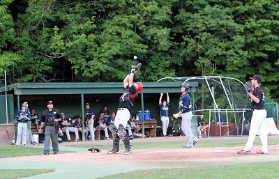 Justin Yurchak (Wake Forest) returns to the dugout after scoring a run.