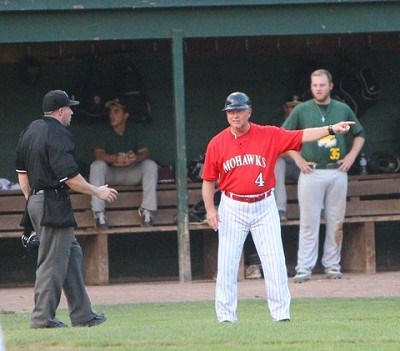 Head coach Keith Griffin talks with the umpire