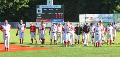 The Mohawks return to the dugout following Coach Griffin's pre-game speech.