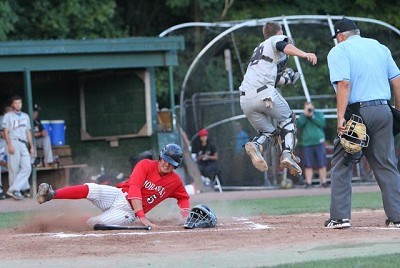 Keith Skinner (Fairfield) slides under Luke Nethaway (Saint Rose) as Jordan Ebert singles in the second inning