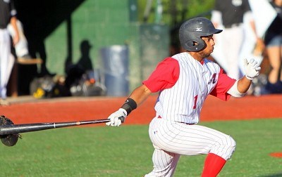 Kentucky center fielder Marcus Carson leads off the game with a base hit through the right side.