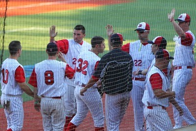 Joe Purritano of Dartmouth returns to the dugout after scoring on a Tom Kain sac-fly.