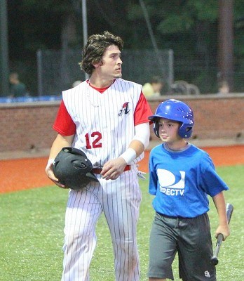 Alex DeBellis of Lynn scores a run after Jack Czeszewski was hit by a pitch with the baases loaded in the eigth inning.