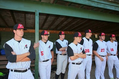 Members of the Amsterdam Mohawks standing in the dugout.